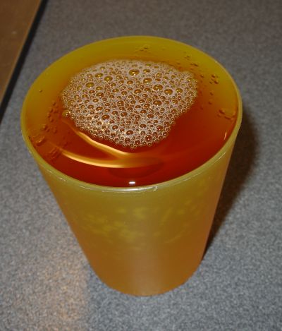 A cup full of apple juice